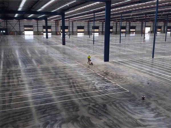 Creating lines in a warehouse where the shelves will be.