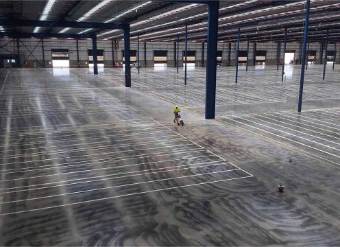 Creating lines in a warehouse where the shelves will be.